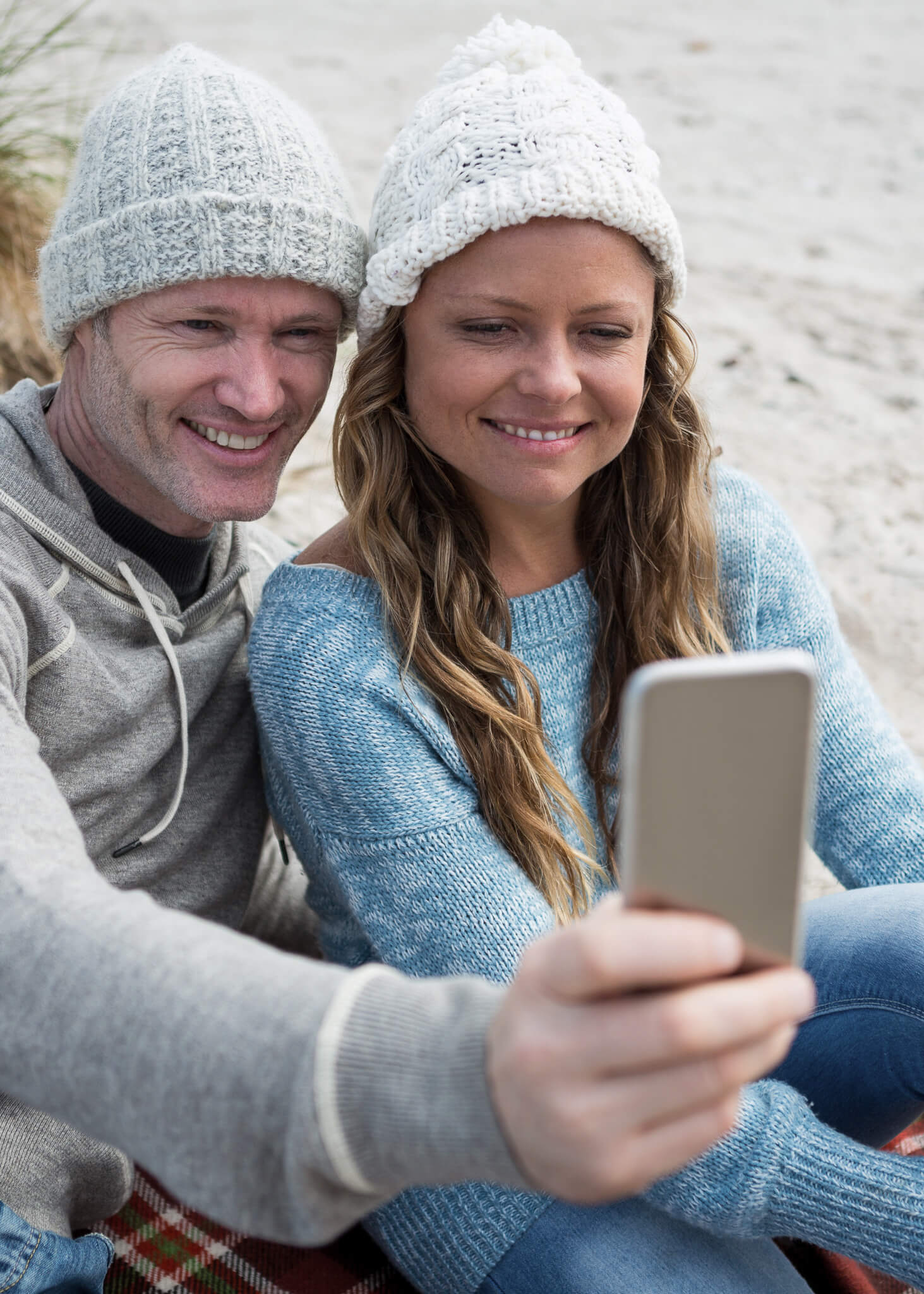 Two people having a woolly hat day to raise money for Derventio
