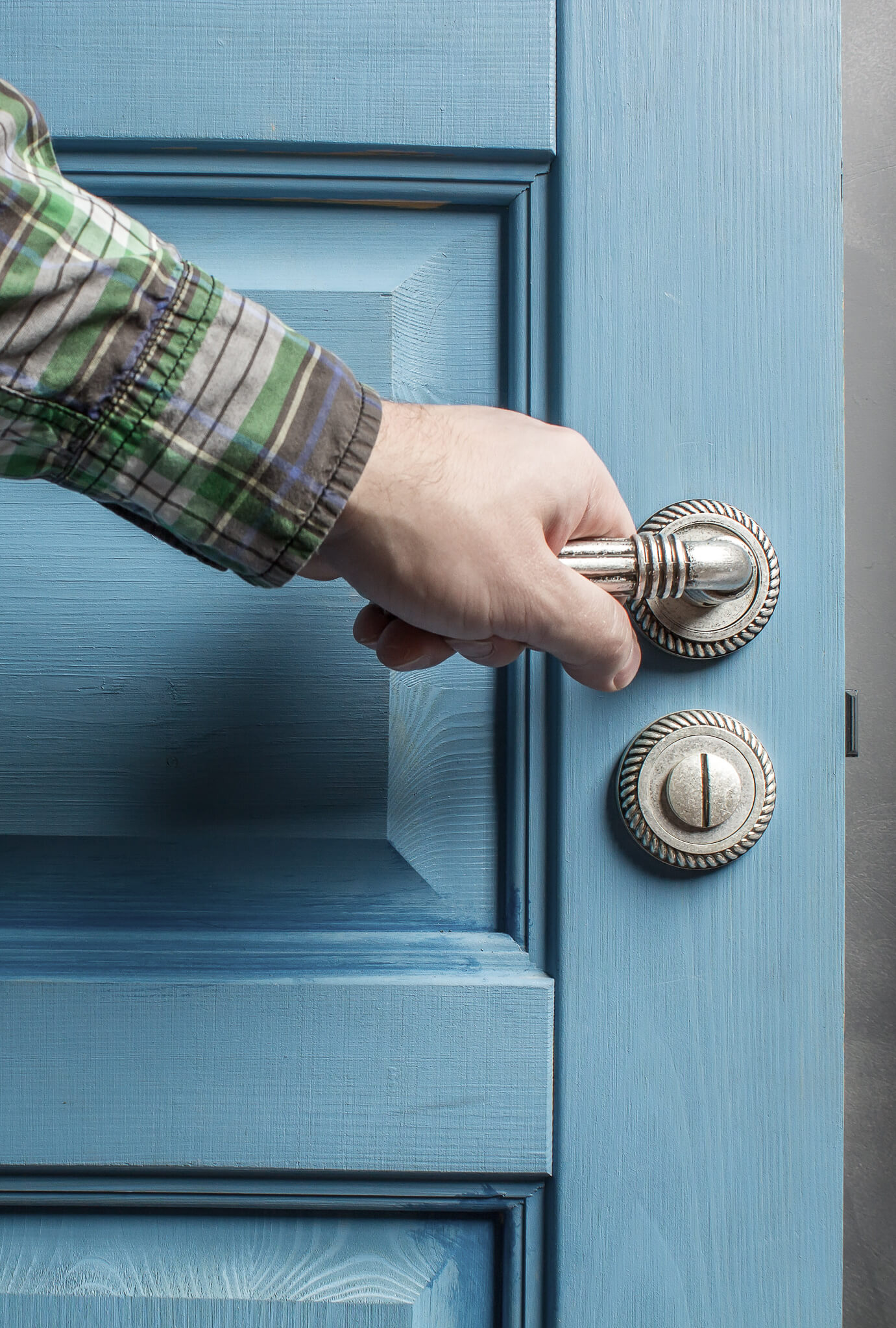 A property owner opening a door