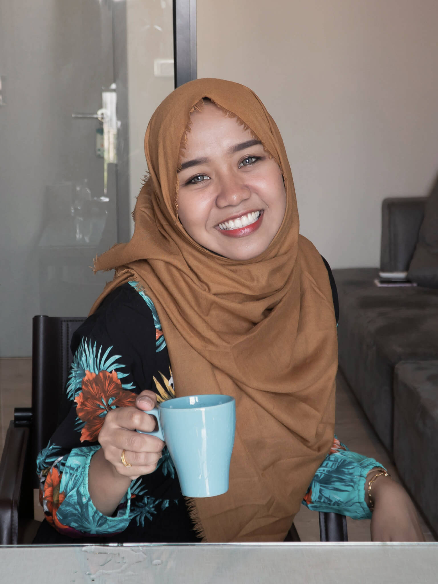 A resident enjoying a cup of tea in Derventio supported housing